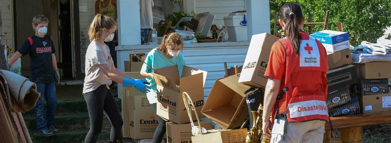 Red Cross volunteer helps family clean up storm damaged home